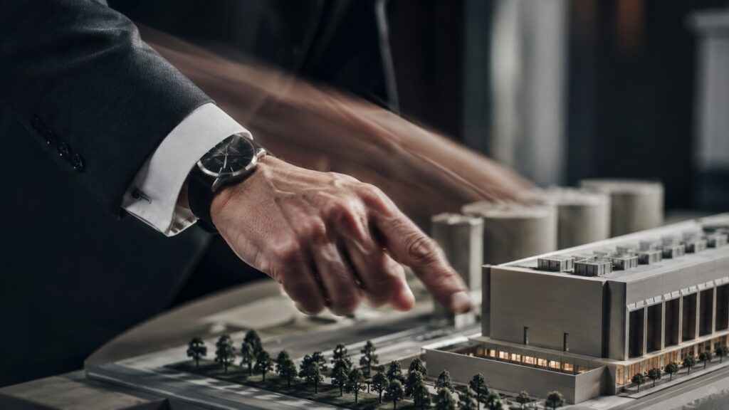 pointing at a mini 3d model of a building, ai generated